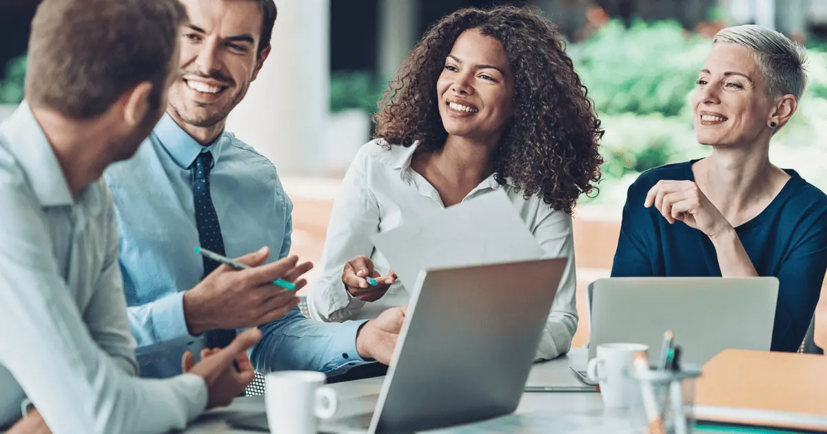Diverse team having a meeting with laptops